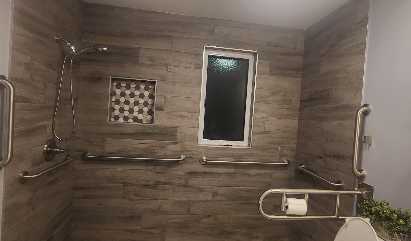 Accessible shower with support rails