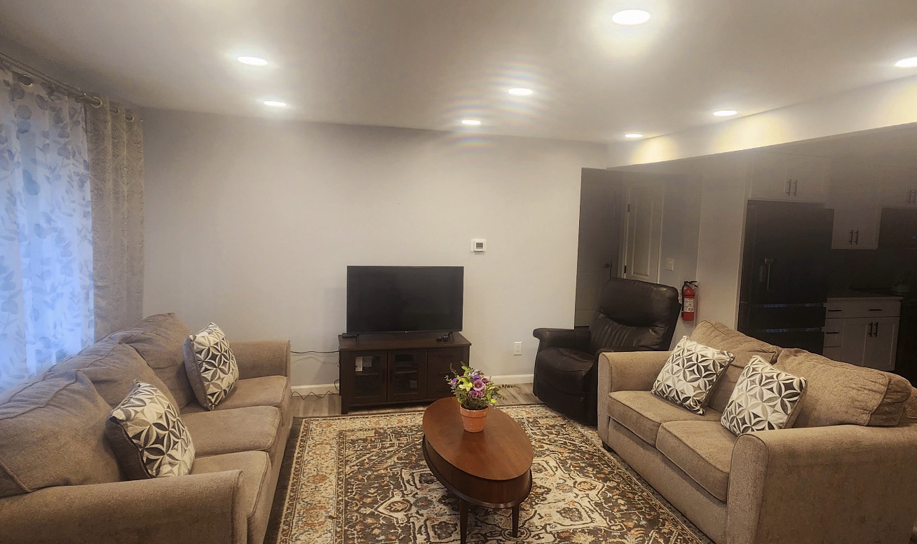 Bright, comfortable living room at Better Days Adult Family Home